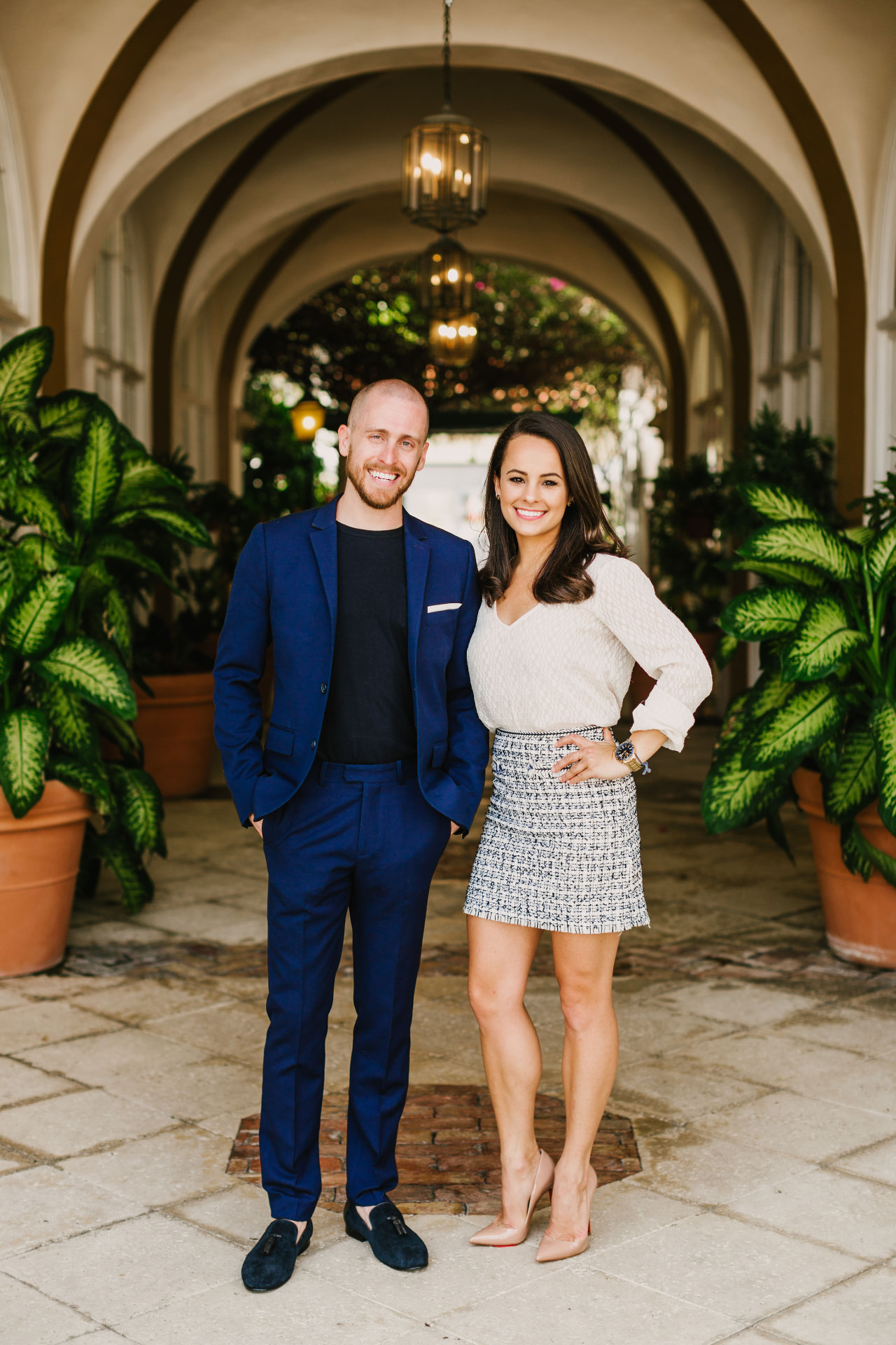 Two Team Slayen agents in a Palm Beach courtyard loggia
