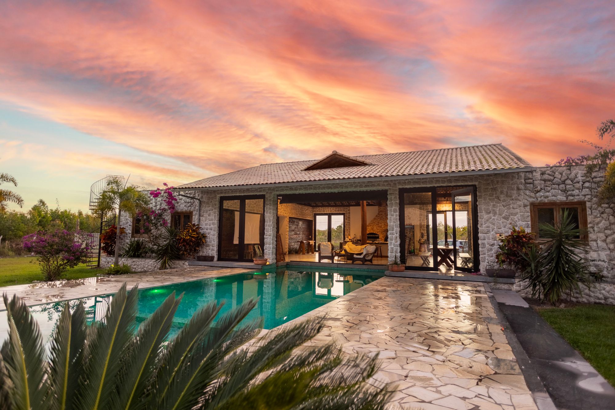 Limestone oceanfront residence at sunrise with a shaded loggia facing the Atlantic