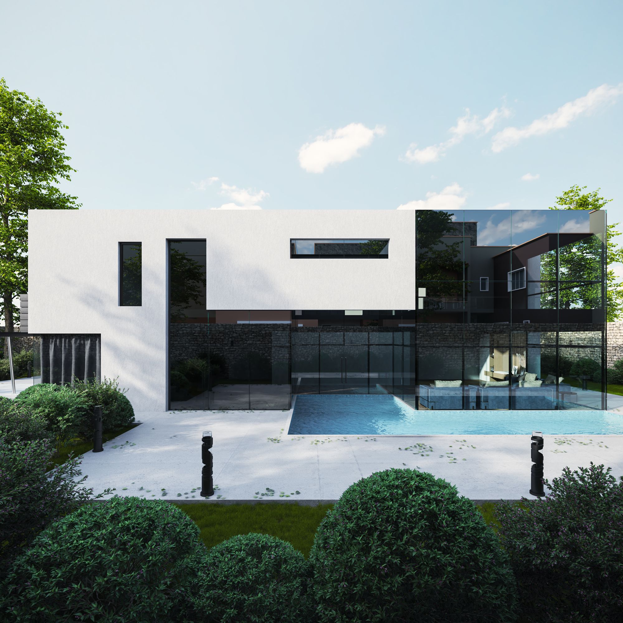 Contemporary limestone residence with glass walls beside a still reflecting pool